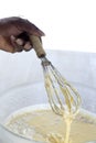 Close-up mixed yolk eggs, flour and sugar prepared for baking