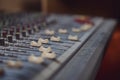 Close-up of a mixer desk. Professional music production in a sound recording studio. Details of sound engineer room. Royalty Free Stock Photo