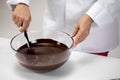 Close up mixing melted chocolate, making hand-crafted chocolate candies Royalty Free Stock Photo