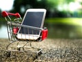 Close up the mobile phone in shopping cart, business in eCommerce concept Royalty Free Stock Photo