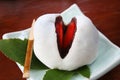 Close up mochi candy dessert with slices of strawberry and sweet mashed taro on wooden background Royalty Free Stock Photo