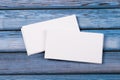 Close-up of two empty stacks of business cards on a blue-violet natural wooden background Royalty Free Stock Photo