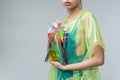 Close up of model holding bag with plastic cups and straws Royalty Free Stock Photo