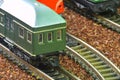 Close-up of model railway carriage on the rail tracks. Perfect model of the diesel locomotive. Train hobby model on the Royalty Free Stock Photo