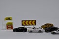 Close up model toy/miniature cars waiting refuel a fuel oil/gas