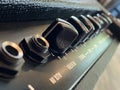 Close-up modern amplifier with black knob and control panel. clean and hi-gain distortion. Royalty Free Stock Photo