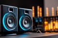 Close-up of modern audio speakers with glowing vacuum tubes in background Royalty Free Stock Photo