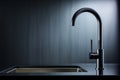 Close-up of modern black matte kitchen faucet, black acrylic stone countertop, stainless steel built-in sink against the Royalty Free Stock Photo