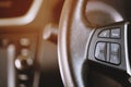 Close up Modern black steering wheel with multifunction Royalty Free Stock Photo