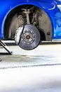 Close up of a modern car brakes during maintenance repair, transport concept Royalty Free Stock Photo