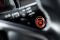 Close up modern car engine start stop button on black leather car console and copy space Royalty Free Stock Photo