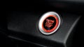 Close up modern car engine start stop button on black leather car console and copy space Royalty Free Stock Photo