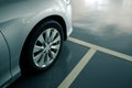 Close up of modern car in parking lot, anti slip coating floor for safety, car parked in the right position in modern building car
