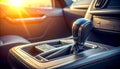 Close up of a modern car\'s automatic gear shift lever in sunlight interior transmission Royalty Free Stock Photo