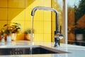 Close-up of modern chrome kitchen faucet with running water, acrylic stone countertop, stainless steel built-in sink Royalty Free Stock Photo