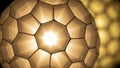 Closeup of a modern geometric light fixture with warm glow Royalty Free Stock Photo