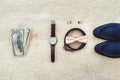 Close up of modern man accessories. Biege bowtie, leather shoes, belt, watch, cufflinks, money and wedding rings. Royalty Free Stock Photo