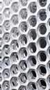 Close-up of modern metal surface with perforated holes and abstract design Royalty Free Stock Photo