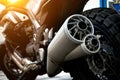 Close-up of a modern motorcycle engine and exhaust system tuning on a city street Royalty Free Stock Photo