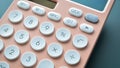 close up modern peach colour pastel calculator and white button on blue background Royalty Free Stock Photo