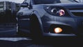 Close up of modern sedan headlamp. Front view shot from side of vehicle