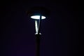 Close-up of a modern street lamp in the city at night Royalty Free Stock Photo