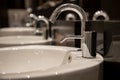 Close up of modern stylish washbasin in a public toilet