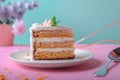 Delicious carrot cake slice with cream cheese frosting on a pastel background Royalty Free Stock Photo