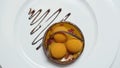 Close-up of molecular dessert made of white cream and chocolate sauce. Stock. Food gourmet. Molecular gastronomy