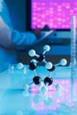 Close up of molecular model with dna sample Royalty Free Stock Photo