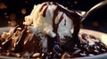 A close-up of molten hot fudge being drizzled over a scoop of vanilla ice cream in