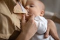 Close up of mom breastfeed baby infant