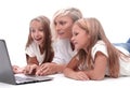 Close up. mom and daughters watching a movie on a laptop Royalty Free Stock Photo