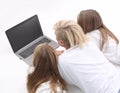 Close up. mom and daughters watching a movie on a laptop Royalty Free Stock Photo