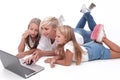 Close up. mom and daughters watching a movie on a laptop Royalty Free Stock Photo