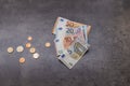 Close up of money banknotes and coins. Euros on dark background Royalty Free Stock Photo