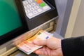 Withdrawing euro banknotes from a cash machine