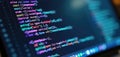 Close-up of monitor screen with program source code. Dark blue background, colorful code syntax. tech concept. Coding, programming Royalty Free Stock Photo