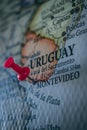 Close up of Montevideo pin pointed on the world map with a pink pushpin Royalty Free Stock Photo