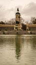 Close-up of the monument of Alfonso XII and its reflection in the Retiro Park on a cloudy winter day in Madrid. Travel concept Royalty Free Stock Photo