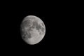 Close-up moon in waxing gibbous phase isolated on a black background and copy space Royalty Free Stock Photo