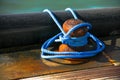 Close-up of mooring bollard with blue rope Royalty Free Stock Photo