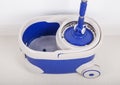 Close up of mop and blue bucket for cleaning floor Royalty Free Stock Photo