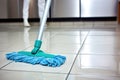 close-up of a mop cleaning a bathroom floor Royalty Free Stock Photo