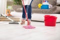Close up of mop, housewife with mop cleans floor