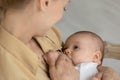 Close up of mother breastfeed baby infant