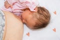 Close up mother breastfeeding an infant. Mother breastfeeding her baby with breast milk. The baby girl is 15 days old Royalty Free Stock Photo