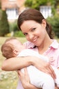 Close Up Of Mother Cuddling Newborn Baby Boy Outdo Royalty Free Stock Photo