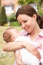 Close Up Of Mother Cuddling Newborn Baby Boy Outdo Royalty Free Stock Photo