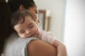 Close Up Of Mother Cuddling Sleeping Baby Daughter At Home Royalty Free Stock Photo